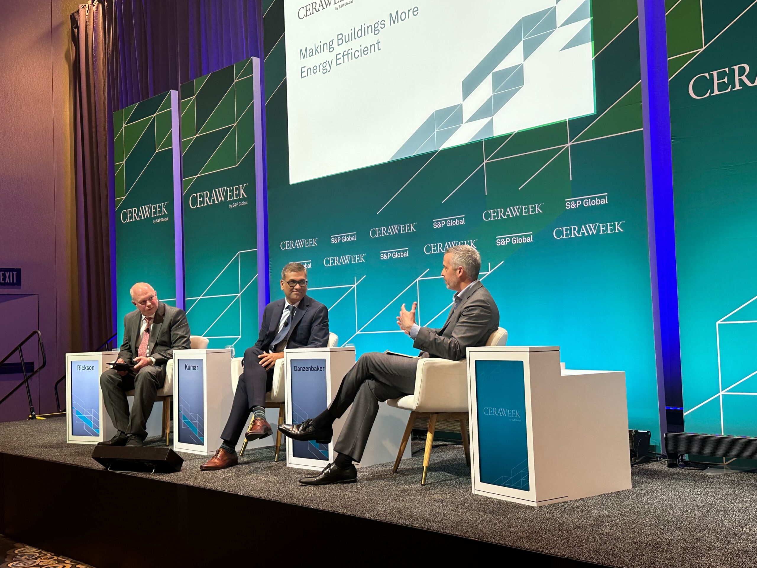 three speakers giving a speech on a stage at ceraweek 2023