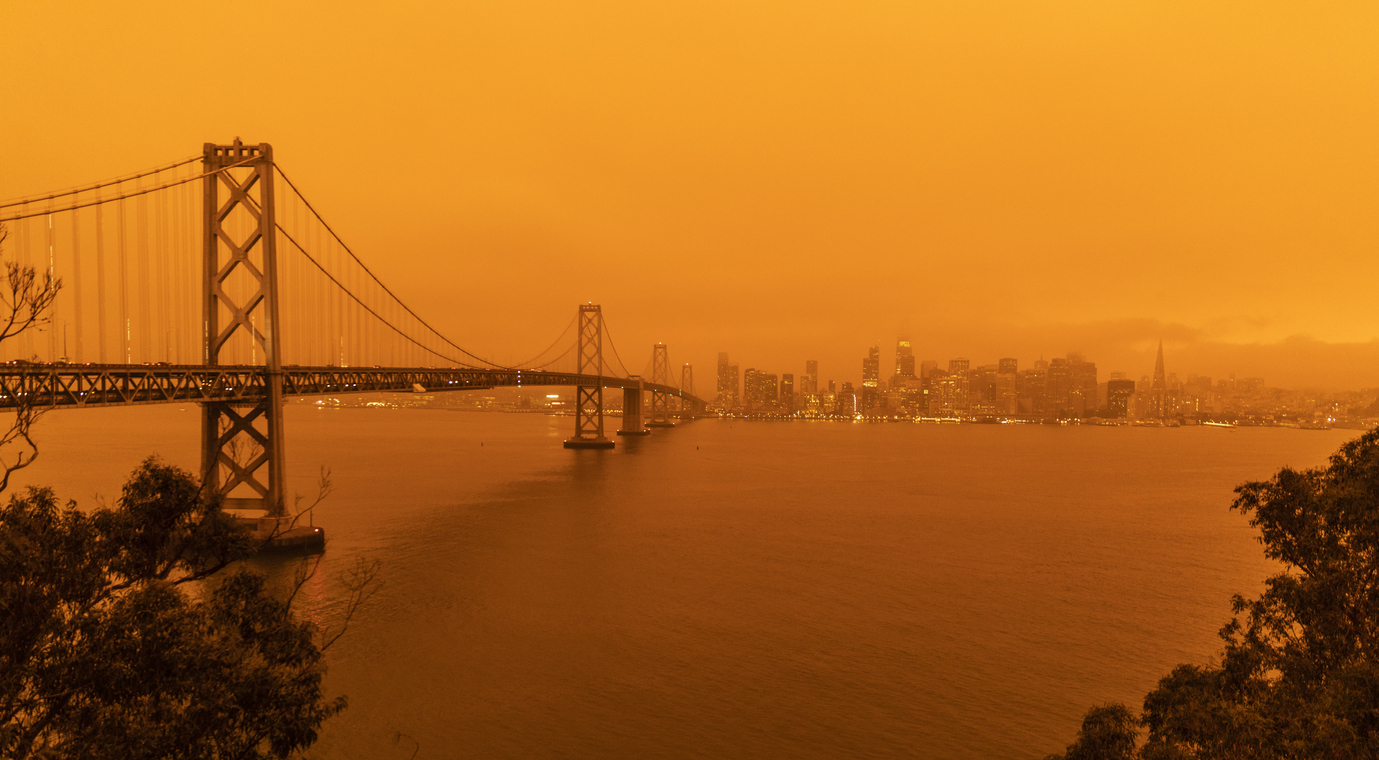 The sky across California darkened and stayed orange during day as smoke from many wildfires across the state created a massive smoke cloud changing the sunlight to a perpetual orange glow.
